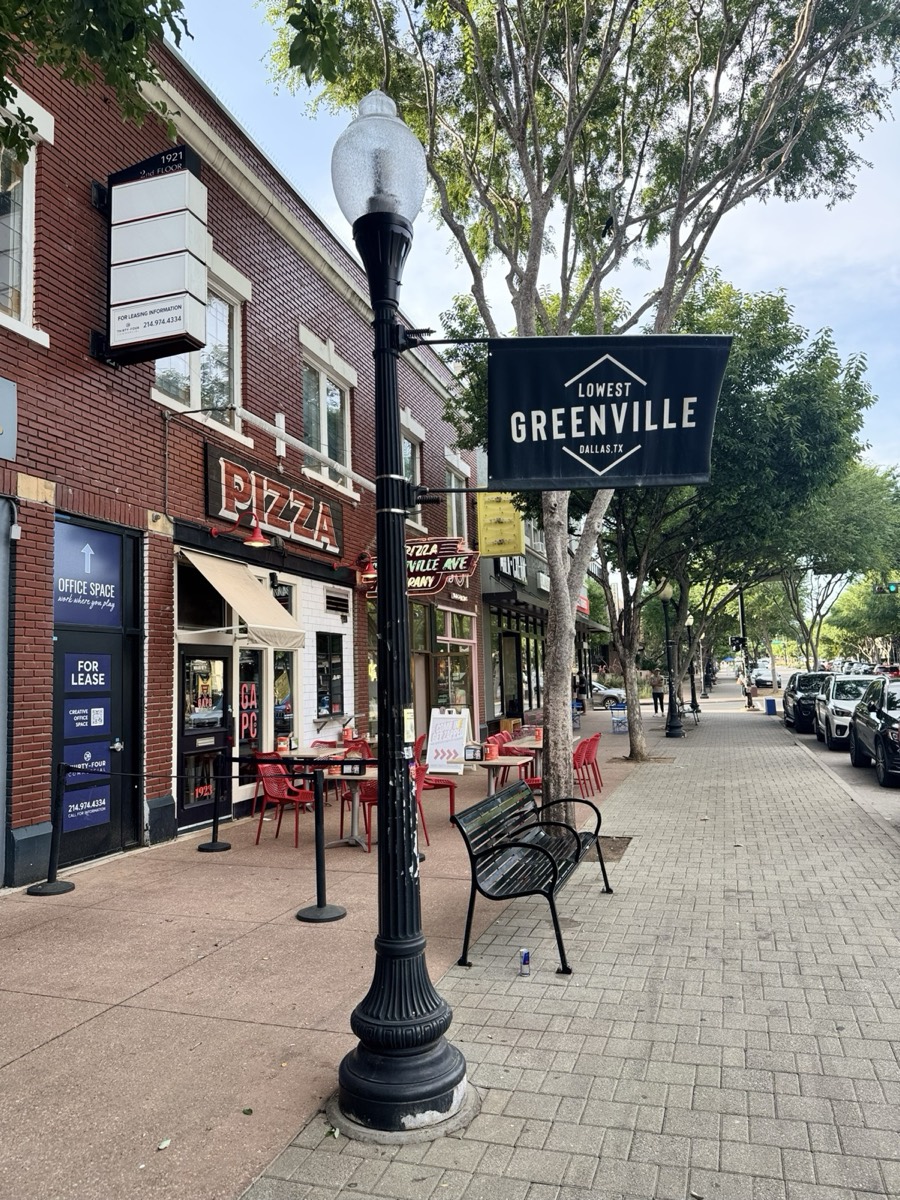 Lowest Greenville banner over a pizza patio on Greenville Avenue
